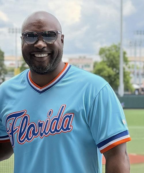 Nick Ndah, Vice President of Construction, in a baseball jersey